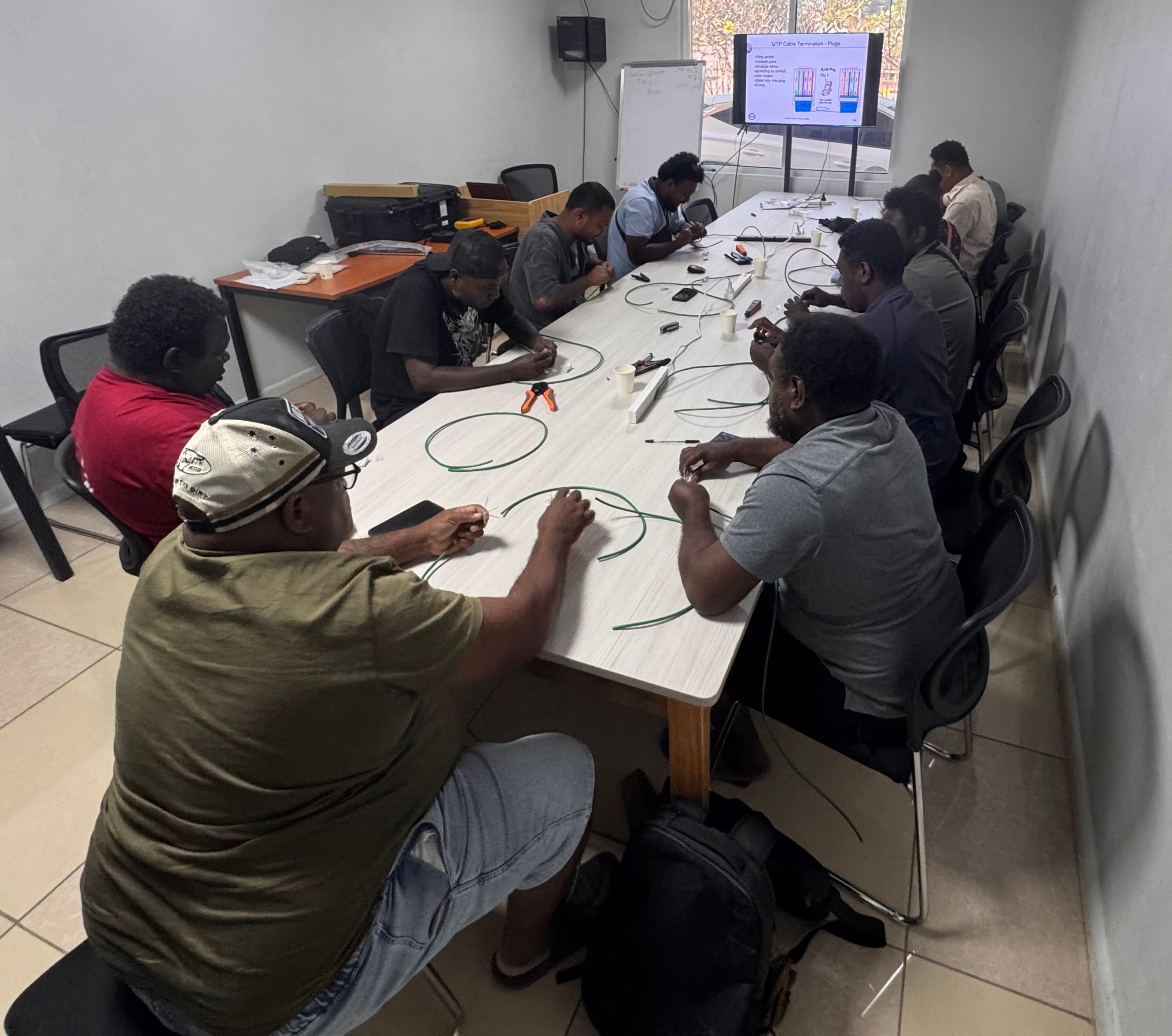 Participants completing hands-on copper cable termination practice