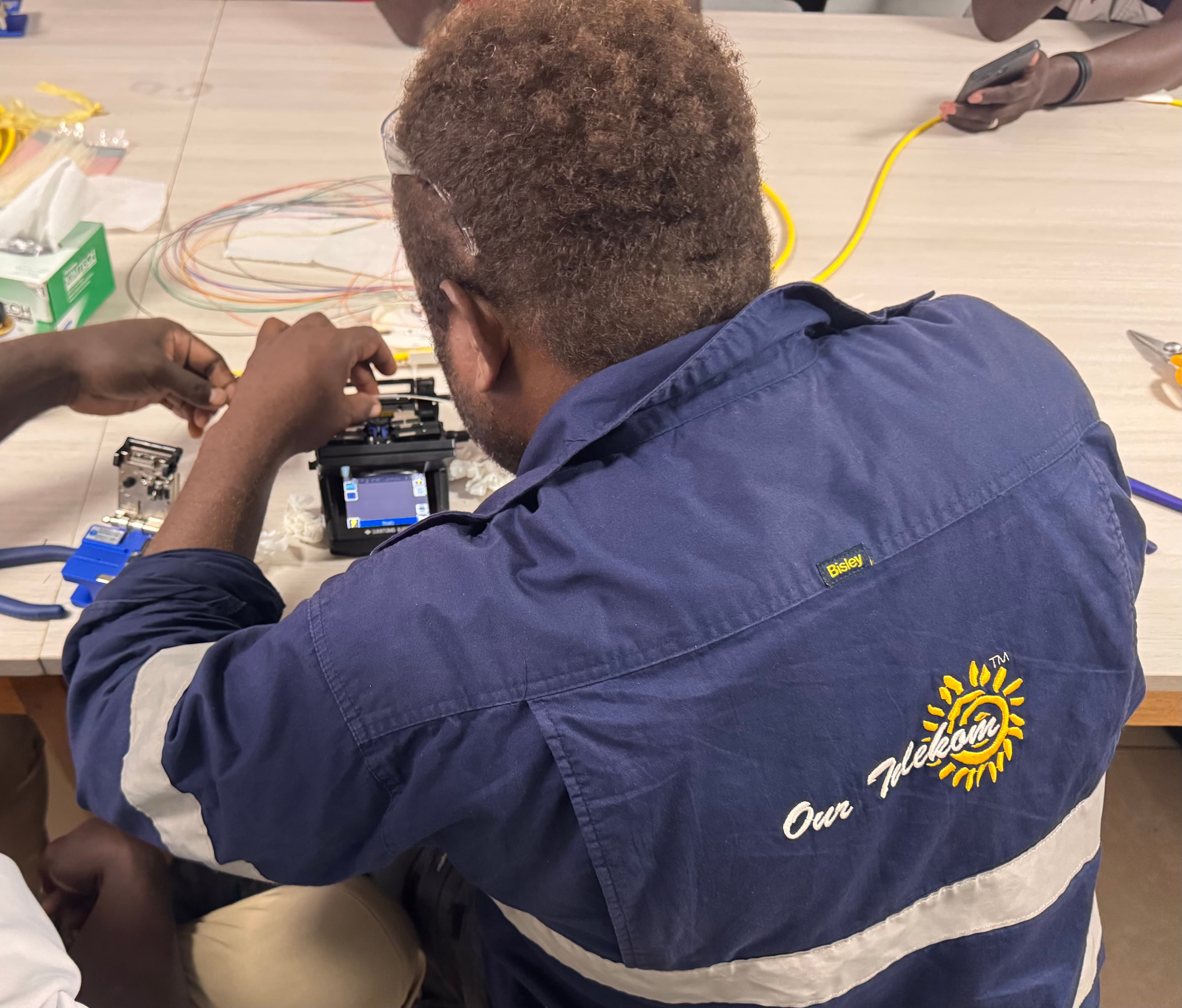 Participant preparing fibre in a fusion splicing exercise
